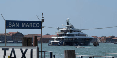 The yacht Arience is moored in front of St. Mark's Square in Venice, Italy, on Wednesday, June 25, 2025, ahead of festivities in the lagoon city reportedly linked to a wedding celebration for Jeff Bezos and Lauren Sánchez. (AP Photo/Luca Bruno)