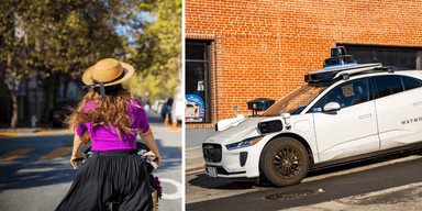 Waymo självkörande bil och cyklist i stadsmiljö.