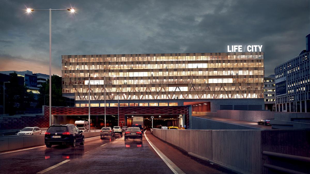 Astra Zeneca ska flytta delar av sin verksamhet till byggnaden Life City som ligger rakt ovanför E4:an i det växande Life Science-klustret vid Karolinska universitetssjukhuset i Hagastaden i Stockholm